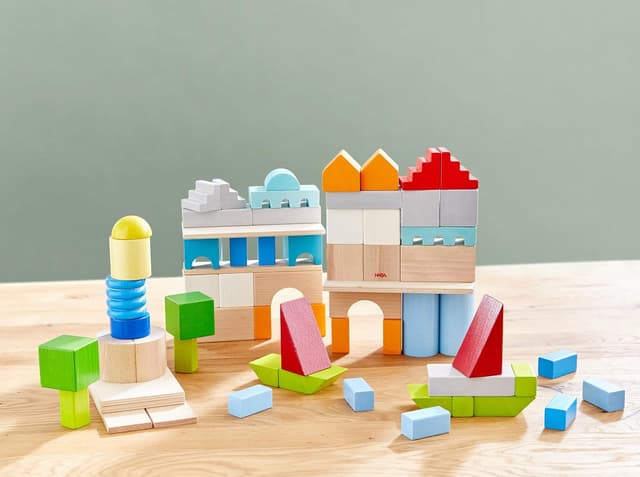 Detalle 2 de HABA Basis Holzbausteine 85 bunte Bausteine mit Baumwolltasche (ToyAward 2024) – für Kinder ab 1 Jahr