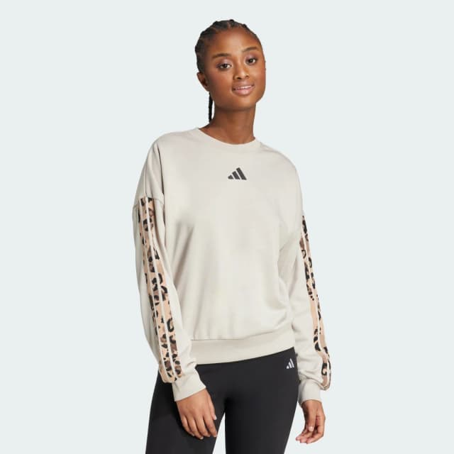 Detalle de adidas Sudadera de felpa Animal Print con 3 bandas en color beige
