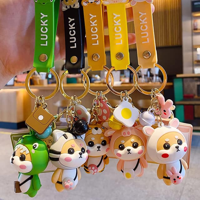 Detalle de Porte-clés femme Shining crown au pendentif Shiba Inu (style fraise) en PVC silicone