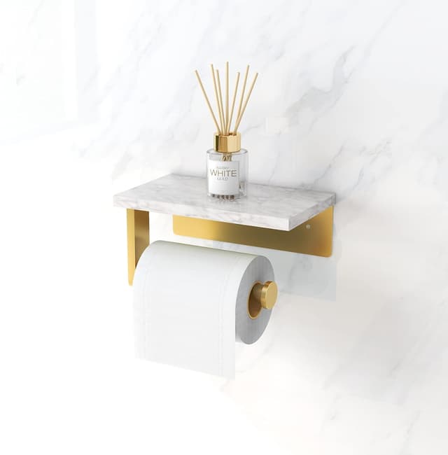 Detalle de Gypie wall-mounted toilet roll holder with marble shelf (304 stainless steel) in matt gold