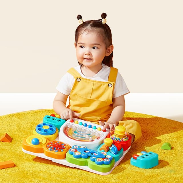 Detalle 2 de Auby Busy Board 3.0 sensoriel détachable (1 à 6 ans) avec 7 outils portables pour motricité fine