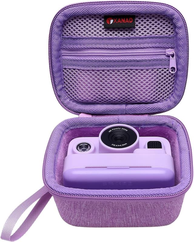 Detalle de XANAD Kinderkamera Tasche für Sofortbildkamera – Schutzhülle mit Thermodruckpapier, Gurt und Hartschale (Lila)