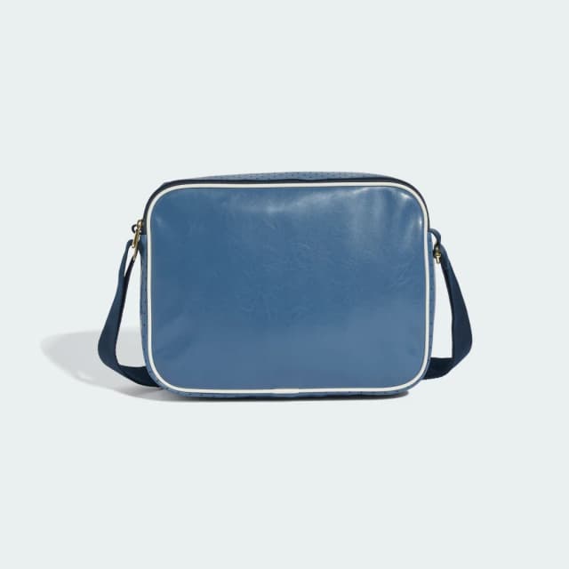 Detalle 2 de adidas Minibolso Airliner en azul: un accesorio compacto para el día a día