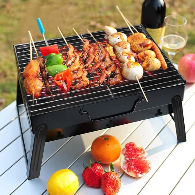 Detalle de Uten petit barbecue pliable à charbon pour table, compact et transportable
