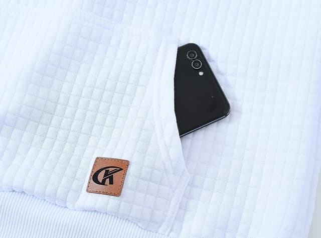 Detalle de YuKaiChen men’s pullover hoodie with plaid jacquard patchwork, drawstring hood and pockets