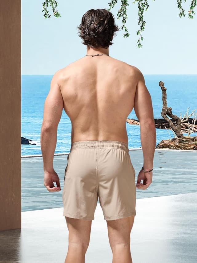 Detalle de Arcweg men’s 2-in-1 swim trunks with compression liner, quick-dry stretch and zip pockets