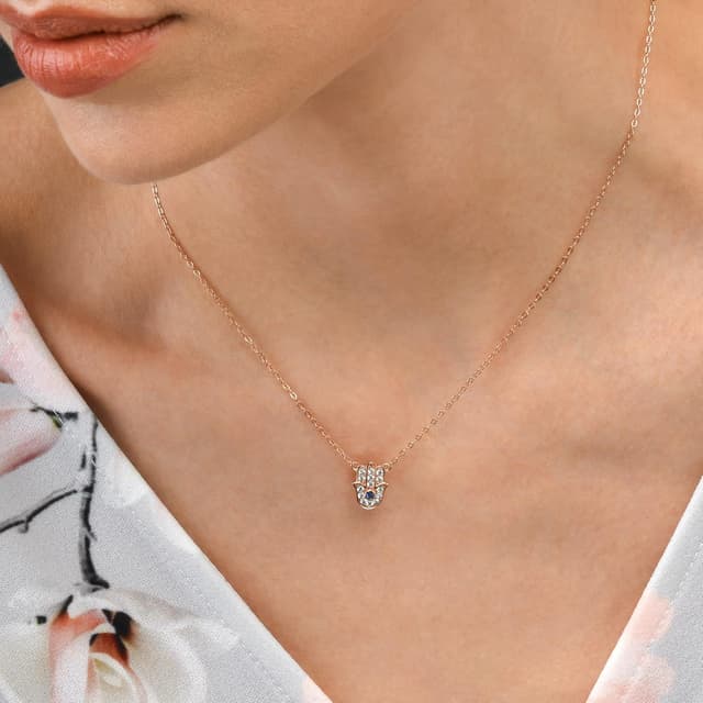 Detalle de Diamond Treats collier Khamsa Main de Fatma en argent 925 plaqué or rose, pendentif zircone bleu