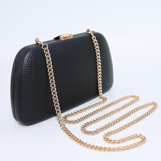 Detalle de Milisente suede clutch bag with metallic clasp closure and gold shoulder chain