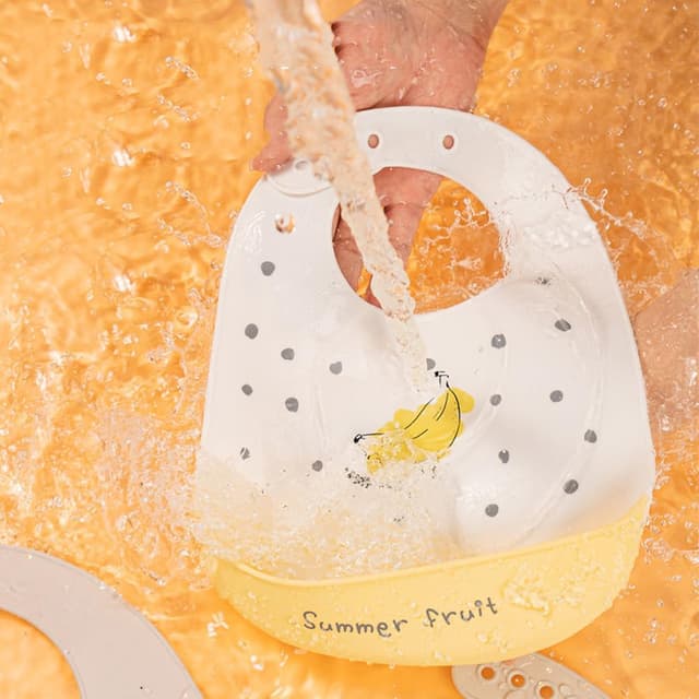 Detalle de SLOSH bavaglino in silicone impermeabile con tasca raccoglipappa (6 mesi–6 anni)