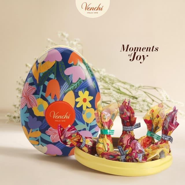 Detalle 2 de Venchi uovo di cioccolato in latta apribile (77 g) con 7 ovetti assortiti senza glutine