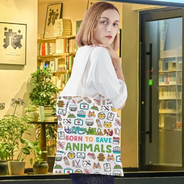 Detalle de LEVLO Veterinarian Cosmetic Bag – cotton canvas zip pouch with “Born to Save Animals” print