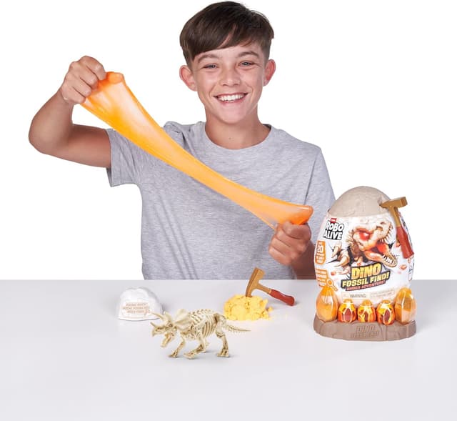 Detalle de ROBO ALIVE Fossil Find Amber Adventure di ZURU con Triceratops, scatola da scoprire e dinosauro giocattolo