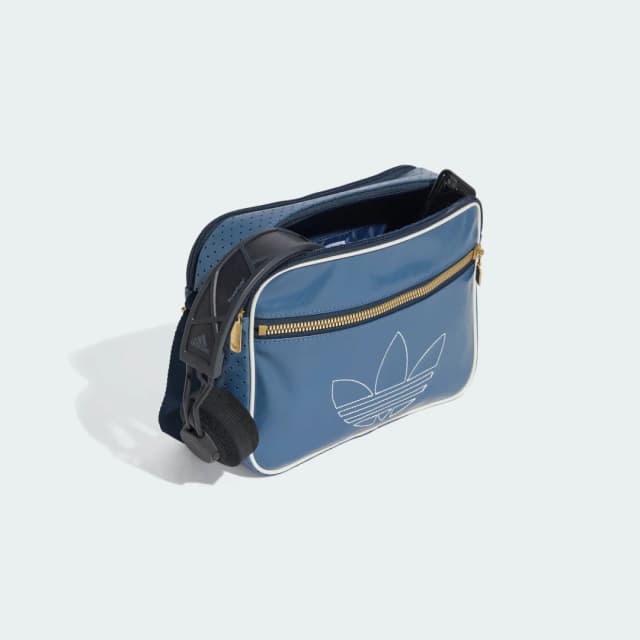 Detalle 2 de adidas Minibolso Airliner en azul: un accesorio compacto para el día a día