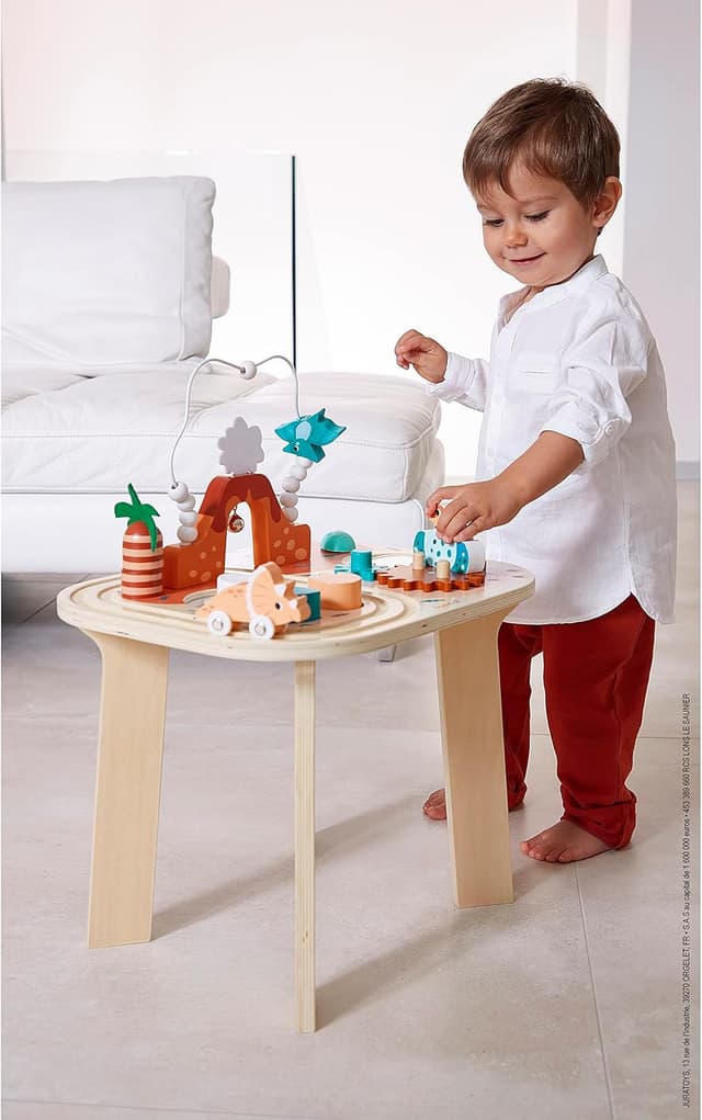 Detalle 2 de Janod Table d’Activités Dinosaure avec 8 activités (dès 12 mois) – Jouet d’éveil en bois FSC