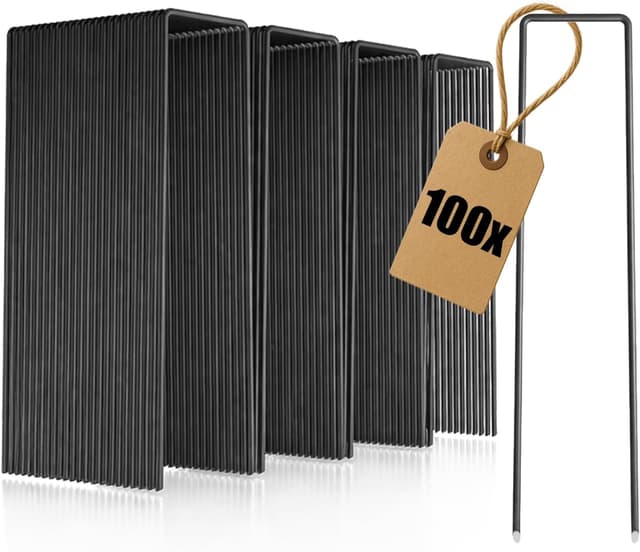 Detalle de COM-FOUR® 100 ancoraggi a terra in acciaio al carbonio (150x25x3 mm) per fissare teli e barriere per erbacce