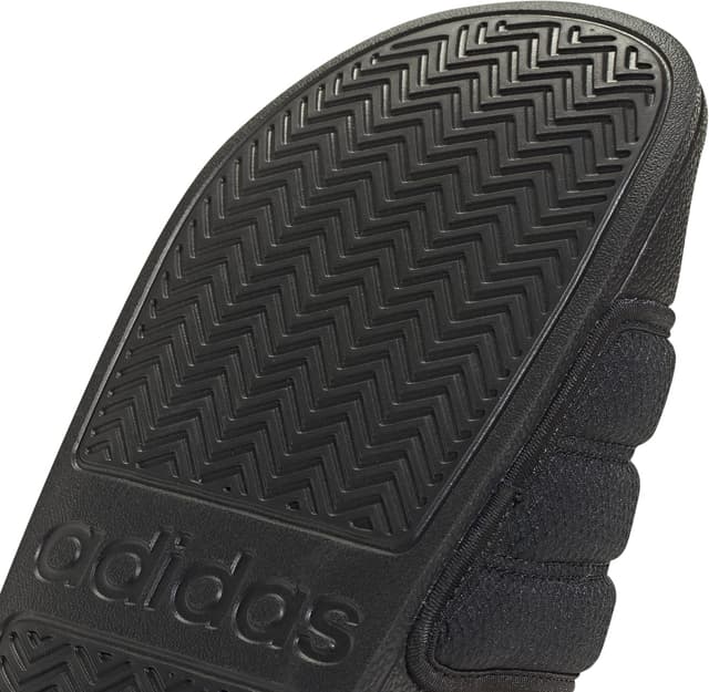 Detalle de adidas Unisex Adilette NOSHOWER Slides in core Black