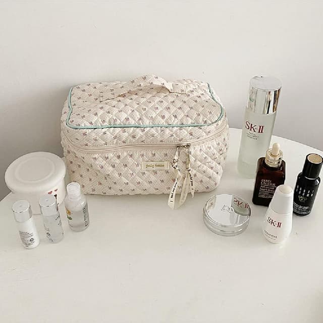 Detalle de Aucuu beauty case da viaggio floreale con organizzatore per trucchi e accessori