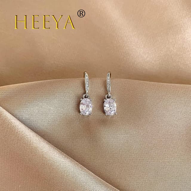 Detalle de HEEYA Ohrringe Silber 925 mit hängenden Zirkonia – runde, Blatt-, Gänseblümchen-, ovale, Tropfen- oder quadratische Formen