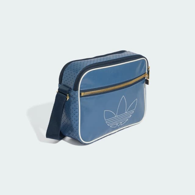 Detalle de adidas Minibolso Airliner en azul: un accesorio compacto para el día a día