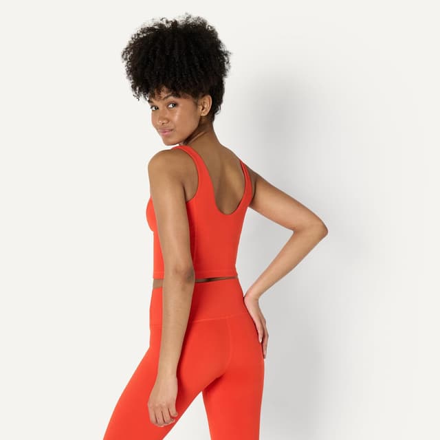 Detalle de Amazon Essentials Canotta tecnica corta FormFlex con reggiseno interno, ross brillante, S