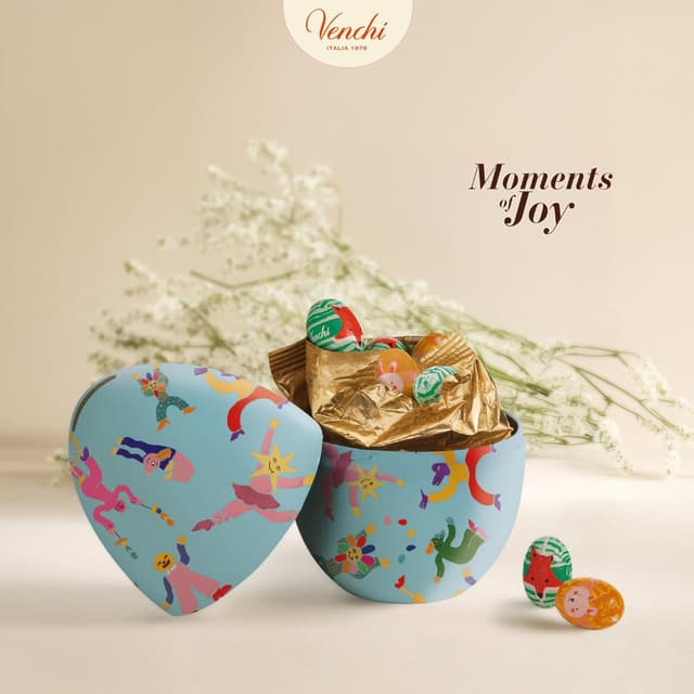 Detalle de Venchi tirelire en métal avec 9 petits œufs au chocolat (100 g) – Collection Printemps