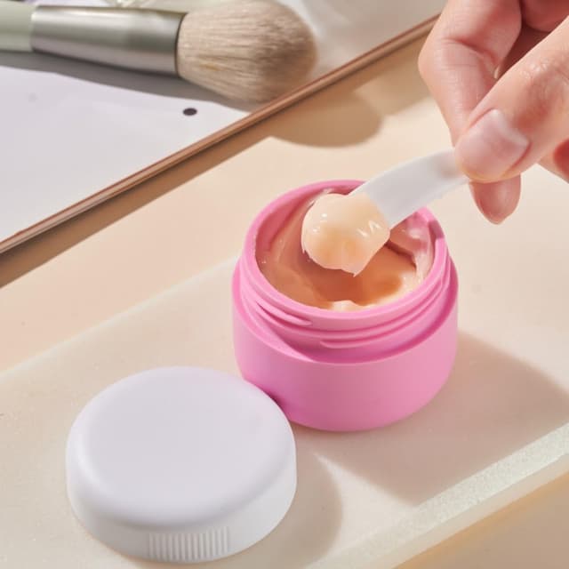 Detalle de Aurdox Reisetöpfe-Set aus Silikon: auslaufsichere Creme-Behälter mit Spatel und transparenter Tasche (TSA-geeignete Mini-Größe)