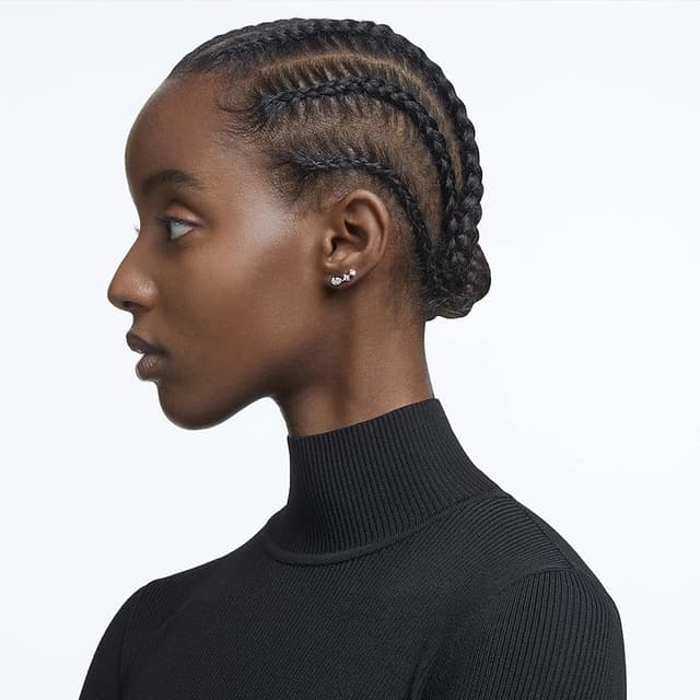 Detalle de Swarovski Mesmera pendientes de botón asimétricos oro rosa 💍