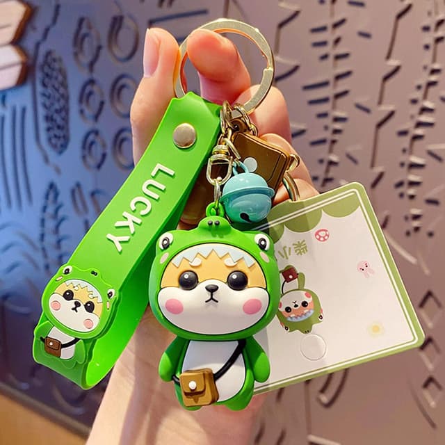 Detalle 2 de Porte-clés femme Shining crown au pendentif Shiba Inu (style fraise) en PVC silicone