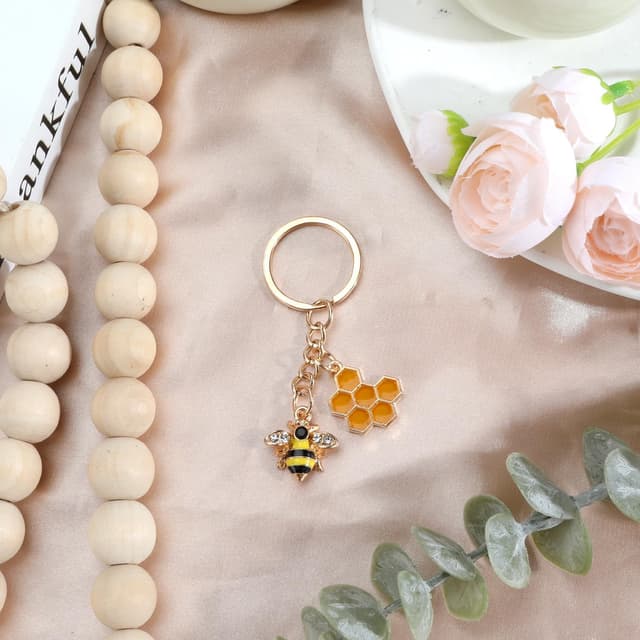 Detalle 2 de Tranbath Süßer Schlüsselanhänger aus Edelstahl mit Bienen-Design und Honigwaben-Anhänger