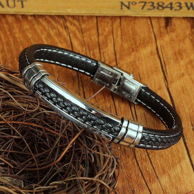 Detalle de Bracciale uomo ATEIELLI in pelle intrecciata e acciaio inox 316L: design Ancora Nautica o Infinito