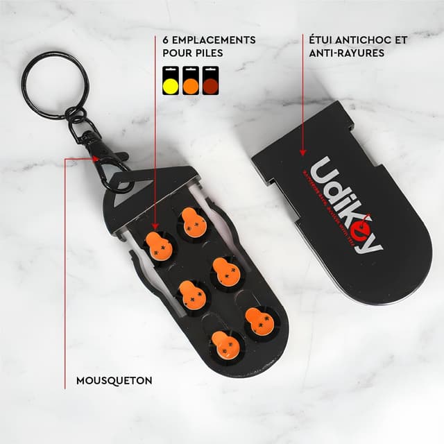 Detalle de Boîte de rangement porte-clés pour piles d’appareils auditifs UdiKey (coque compacte rigide antichoc) – 6 compartiments