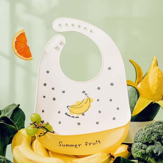 Detalle de SLOSH bavaglino in silicone impermeabile con tasca raccoglipappa (6 mesi–6 anni)