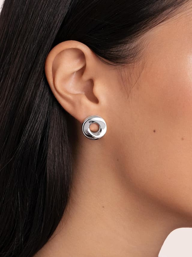 Detalle 2 de SINGULARU Orecchini Orbita in acciaio placcato oro 18Kt