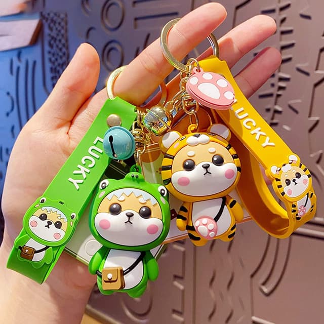 Detalle de Porte-clés femme Shining crown au pendentif Shiba Inu (style fraise) en PVC silicone