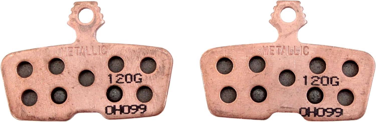 Detalle de SRAM Code sintrade bromsbelägg för MTB i stål med kopparfärg