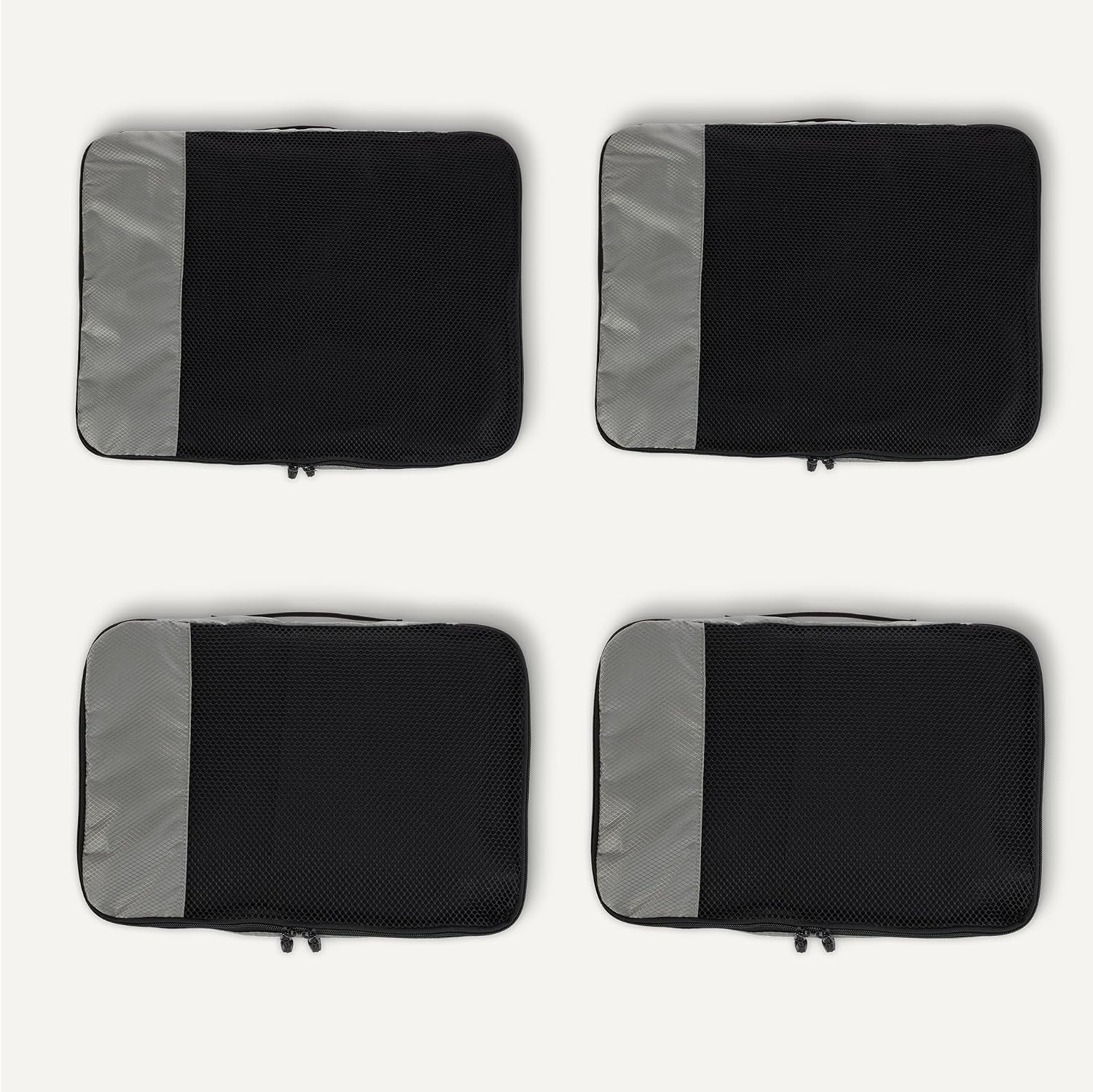 Detalle de Amazon Essentials juego de 4 cubos para viaje (2 medianos y 2 grandes) con doble cremallera y malla