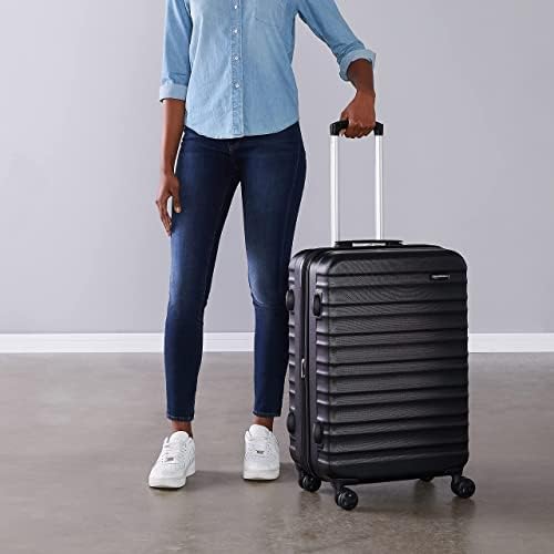Detalle 2 de Amazon Basics Maleta Rígida Mediana Extensible (68 × 45,1 × 28,6 cm) con 4 Ruedas – Negro