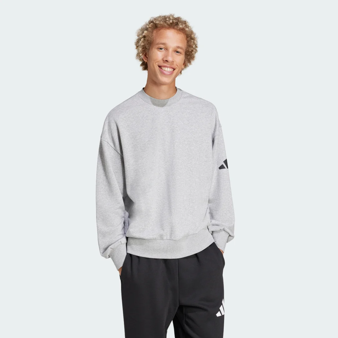 Detalle de Sudadera Essentials Loose Fit 3 Bar Logo de Adidas — guía de compra