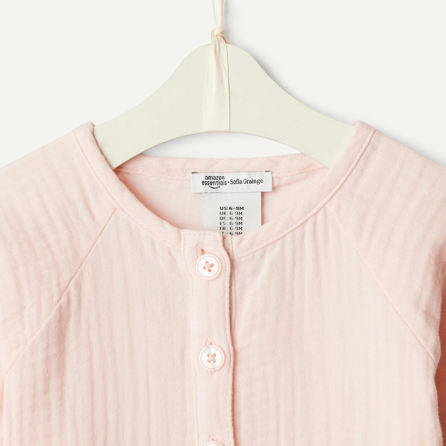 Detalle de Amazon Essentials x Sofia Grainge Unisex Baby Langärmeliger Strampler aus Baumwollgaze