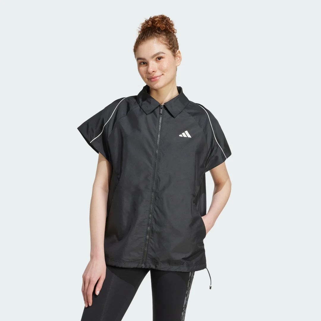 Detalle de Sobrecamisa Stadium de Adidas: negro atemporal para outfits casuales
