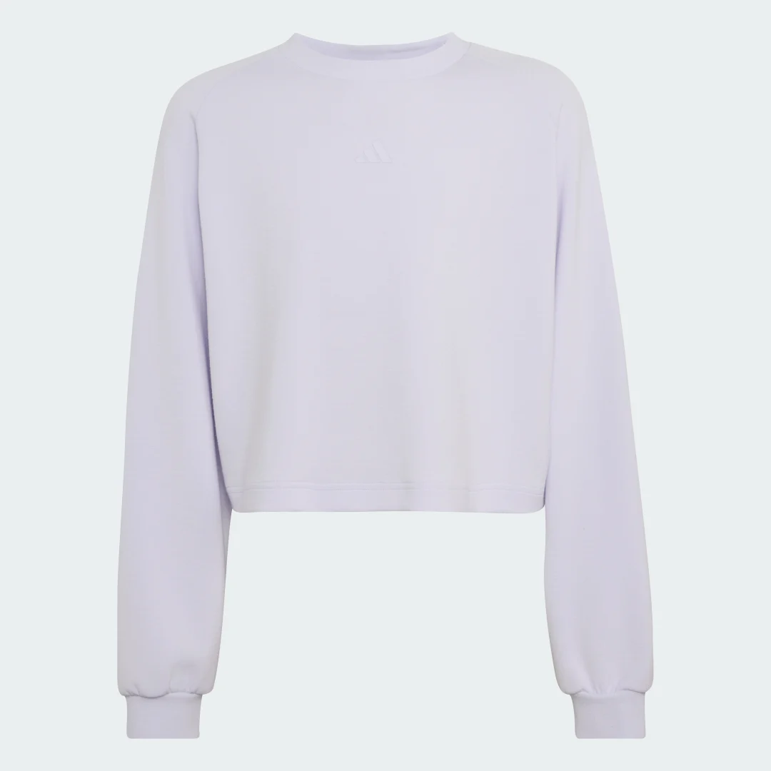 Detalle de Sudadera Adidas en violeta: comodidad y estilo para el día a día