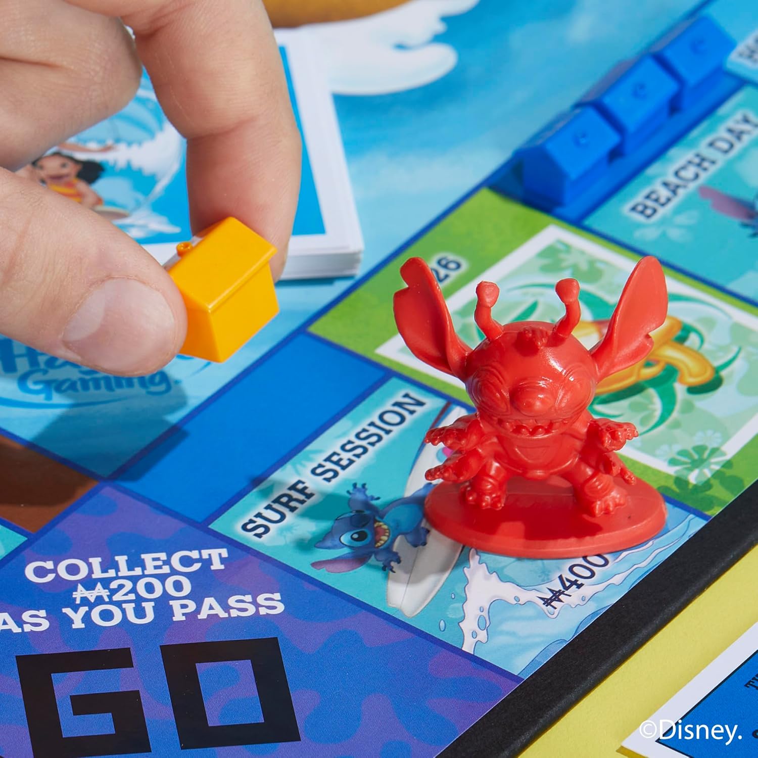 Thumbnail 5 de Monopoly: Disney Stitch Board Game – Family property-trading game for 2–6 players (Stitch-themed tokens & locations)