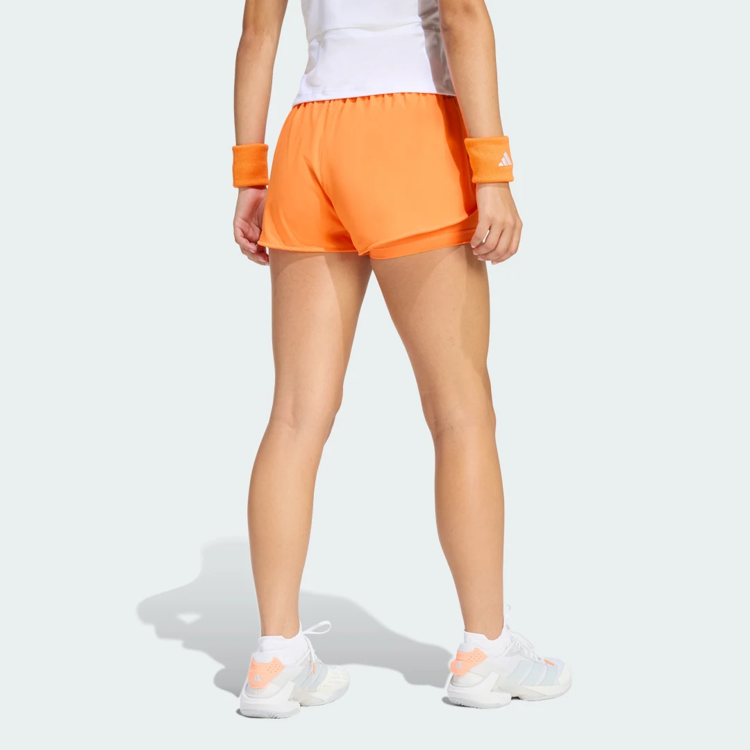Detalle 2 de Pantalón corto de tenis 2 en 1 Climacool Match de Adidas – naranja