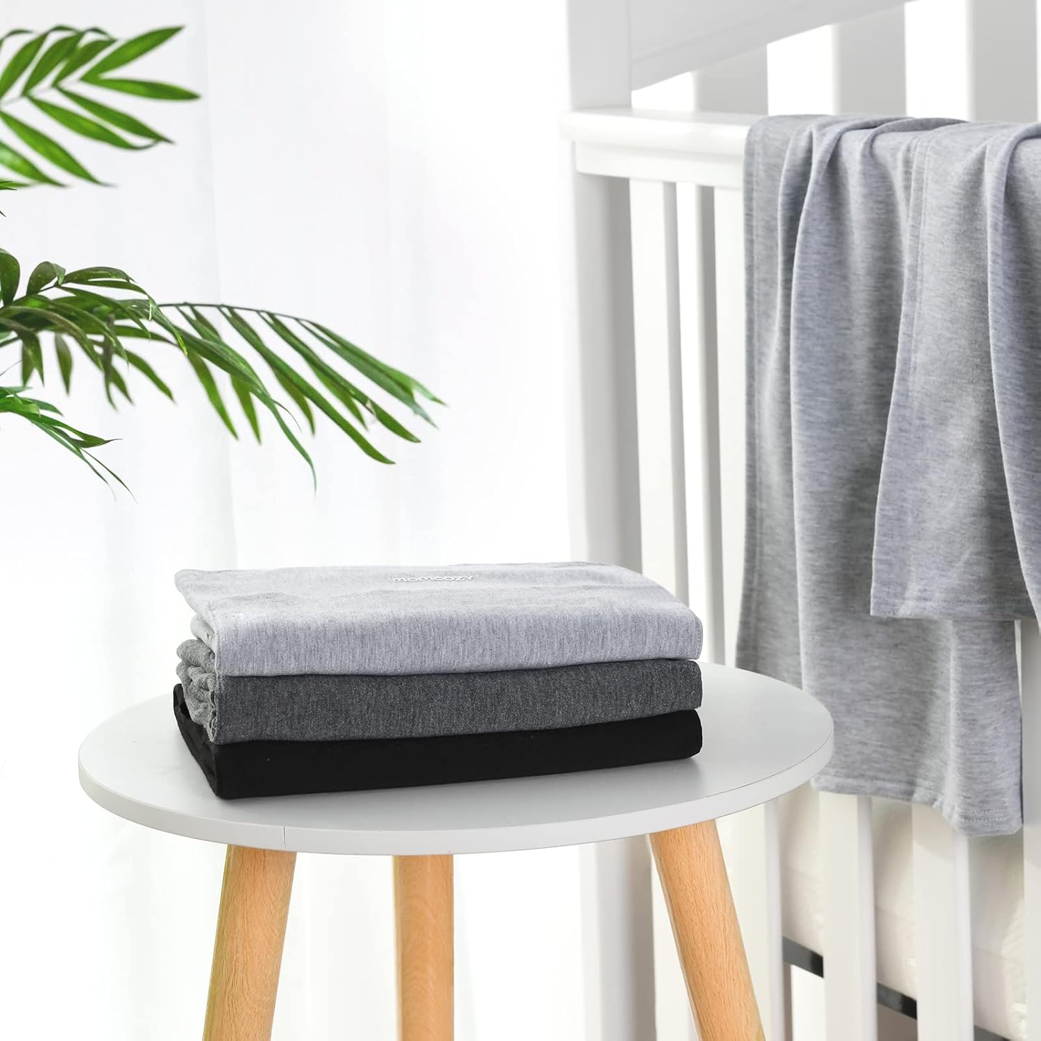Detalle de Momcozy Baby Wrap Carrier: Adjustable 3.6–15kg Sling for Newborn to Toddler (Black)