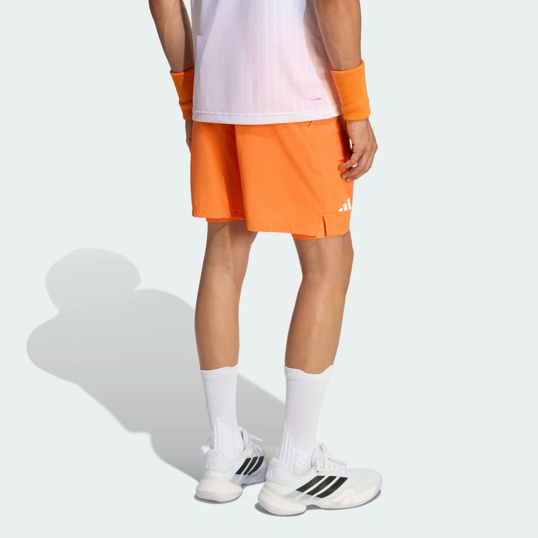 Thumbnail 1 de CONJUNTO PANTALÓN CORTO DE TENIS CON INTERIOR CLIMACOOL de Adidas - color naranja