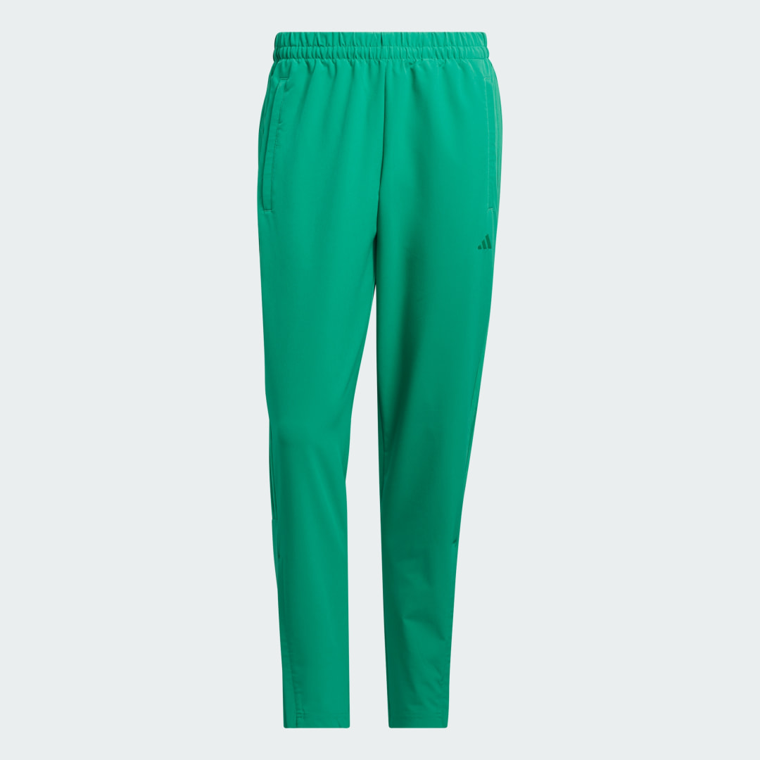 Detalle 2 de Woven Track Pants de Adidas: pantalón deportivo en verde para entrenar y descansar