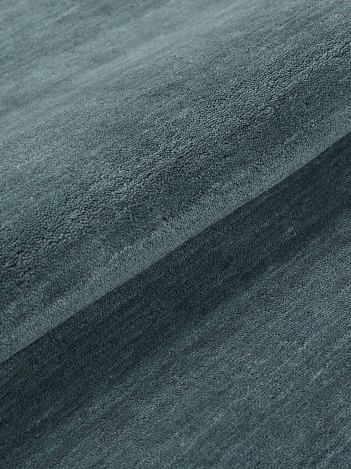 Detalle 2 de RugVista Handloom wollen rond vloerkleed Ø 150 cm, petrolblauw en handgemaakt