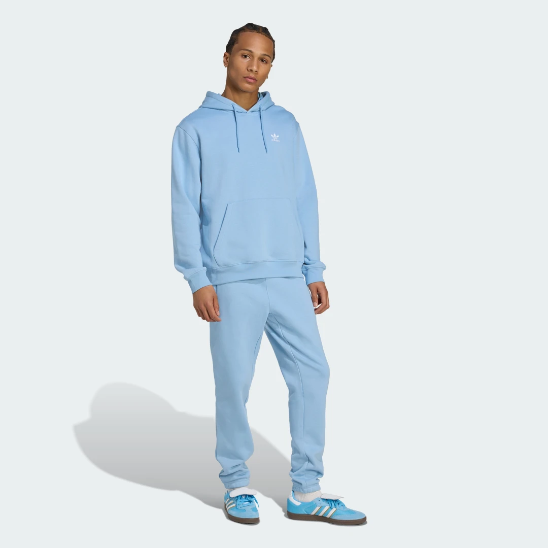 Detalle de Sudadera holgada con capucha Trefoil Essentials de Adidas – azul