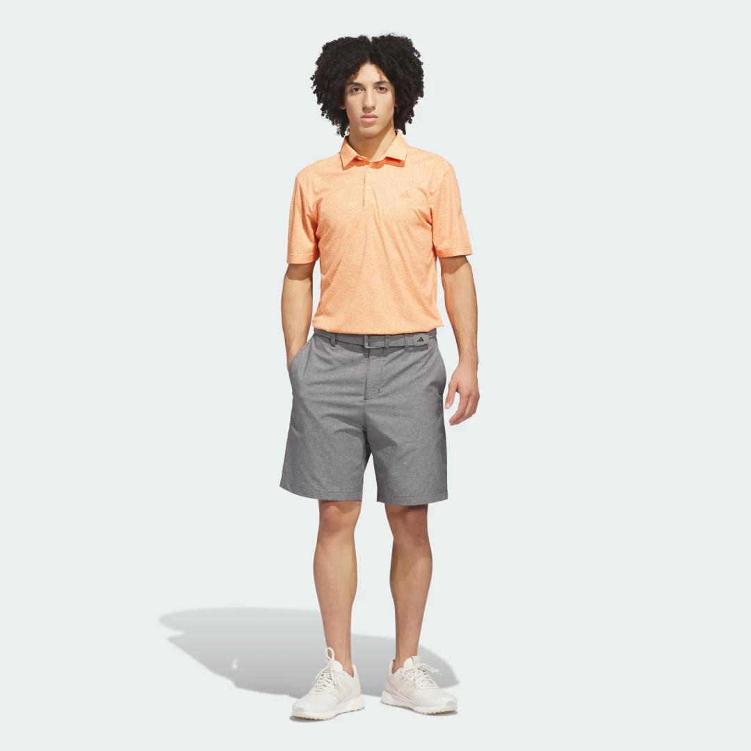 Detalle de Adidas ULTIMATE365 Feather Print Polo Shirt – Naranja