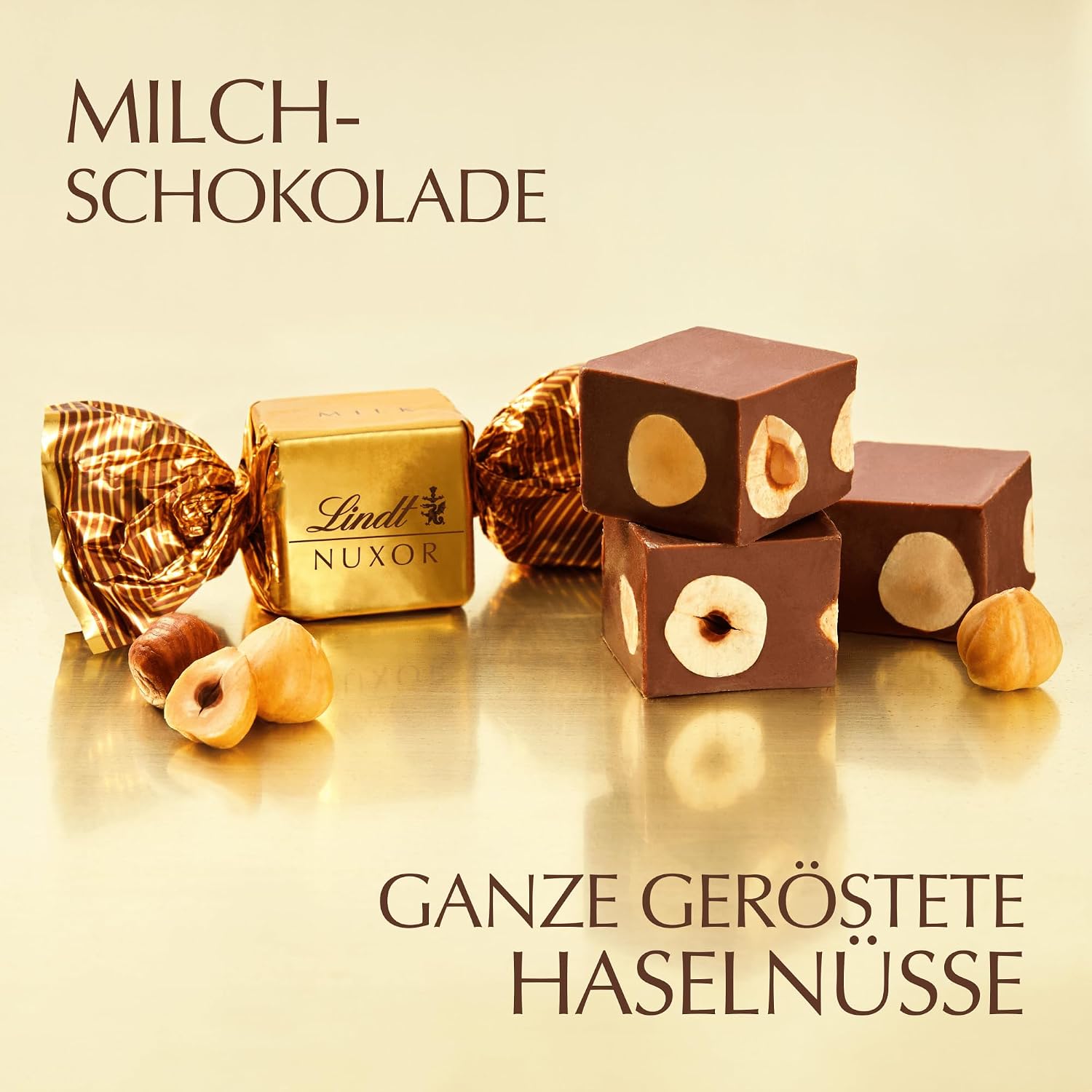 Detalle de Lindt Schokolade | NUXOR Beutel XXL Milch 700 g – Cremige Gianduja-Würfel mit ganzen Haselnüssen